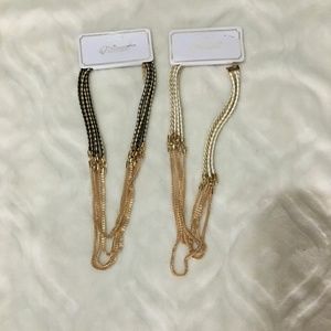 Two necklaces  one white & gold /one black & gold